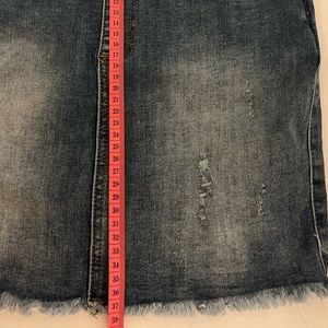 Flap pocket denim raw hem overall dress.